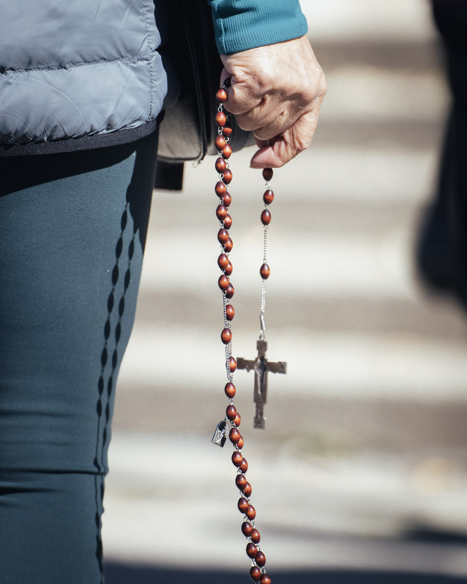 Holy Rosary holded by woman